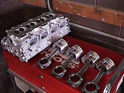 Cylinder head and pistons; engine rebuild
